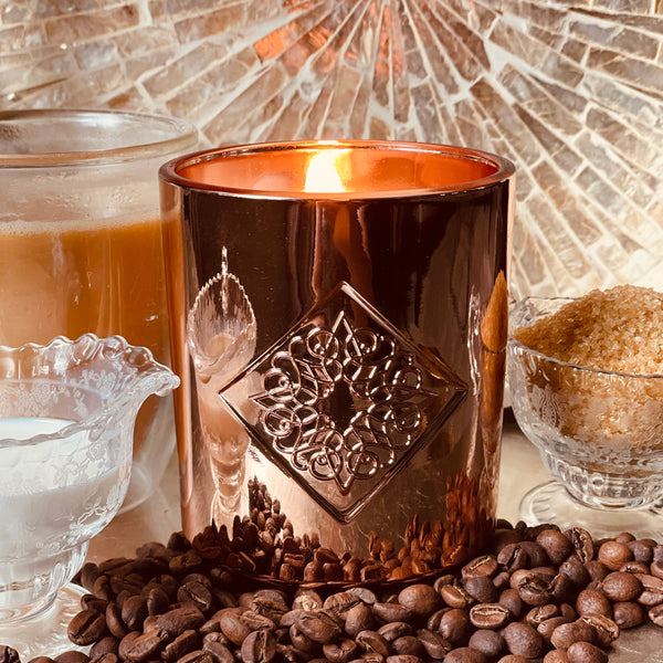Load image into Gallery viewer, rose gold metallic candle with coffee notes with flame.
