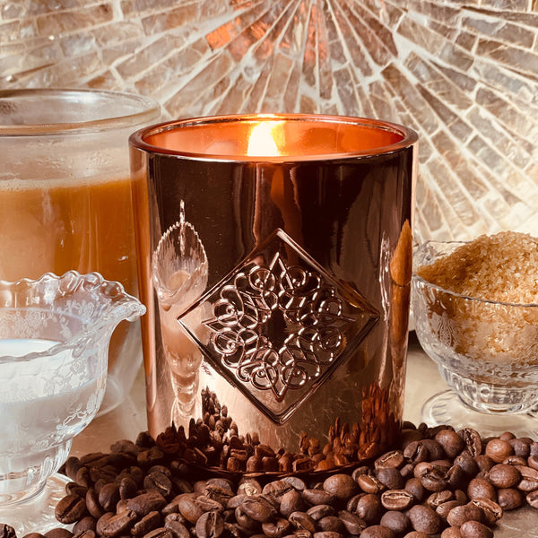 Load image into Gallery viewer, rose gold metallic candle with coffee notes with flame.