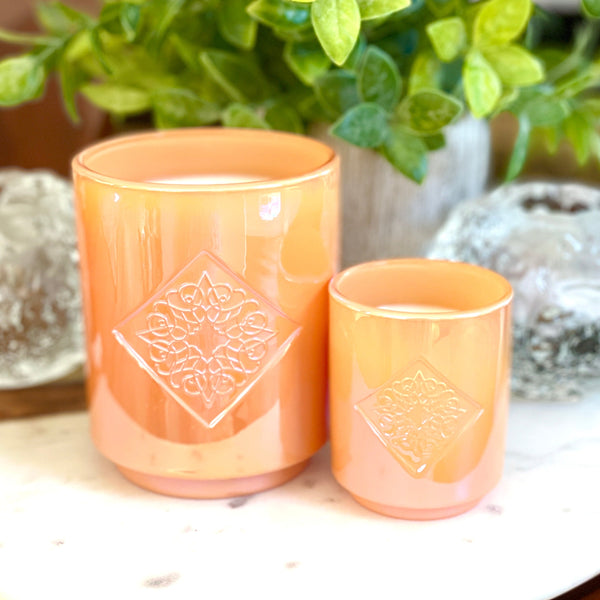 Load image into Gallery viewer, HARMONY orange iridescent OPAL ROAD scented candle in 10 ounce and 2.5 ounce sizes.